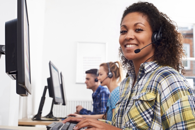 Happy call center agent wearing a headset