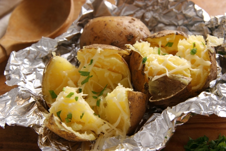 Small baked potatoes in foil